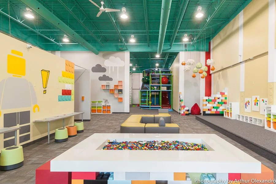 Wide view of the Kaleidoscoppe building centre, including the play structure and LEGO pit table
